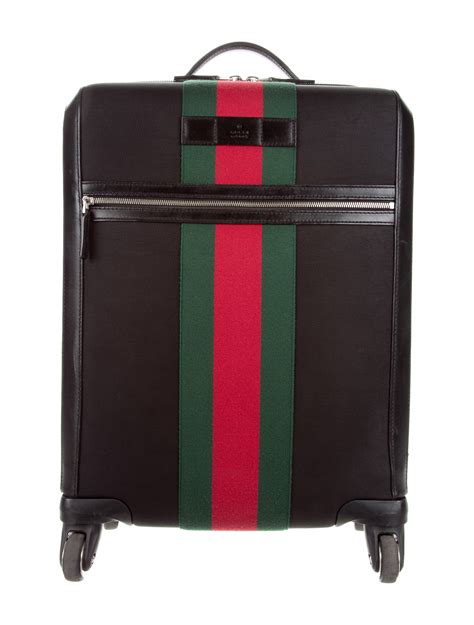 gucci large suitcase.